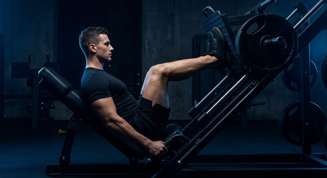 Athlete pressing on a leg press machine