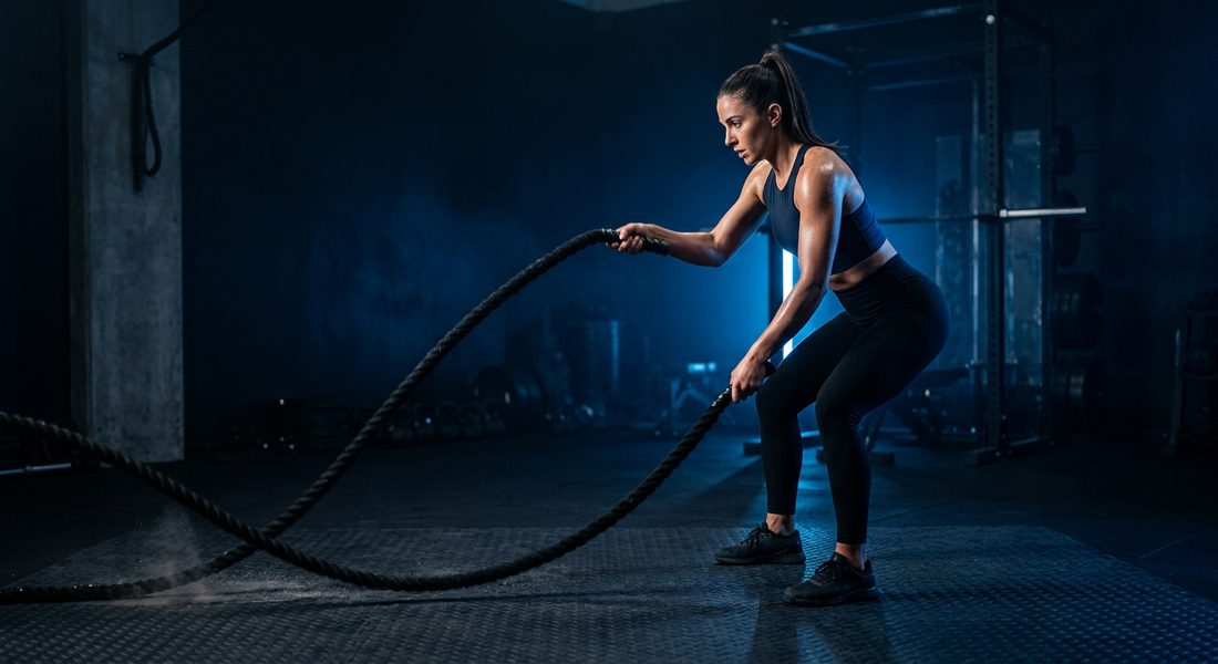 Athlete jumping mid burpee